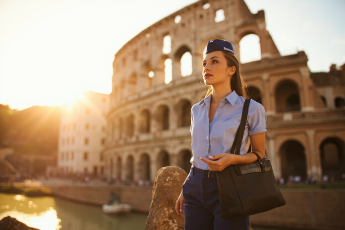 Flight attendant in Rome near the Colosseum on a layover, travel lifestyle